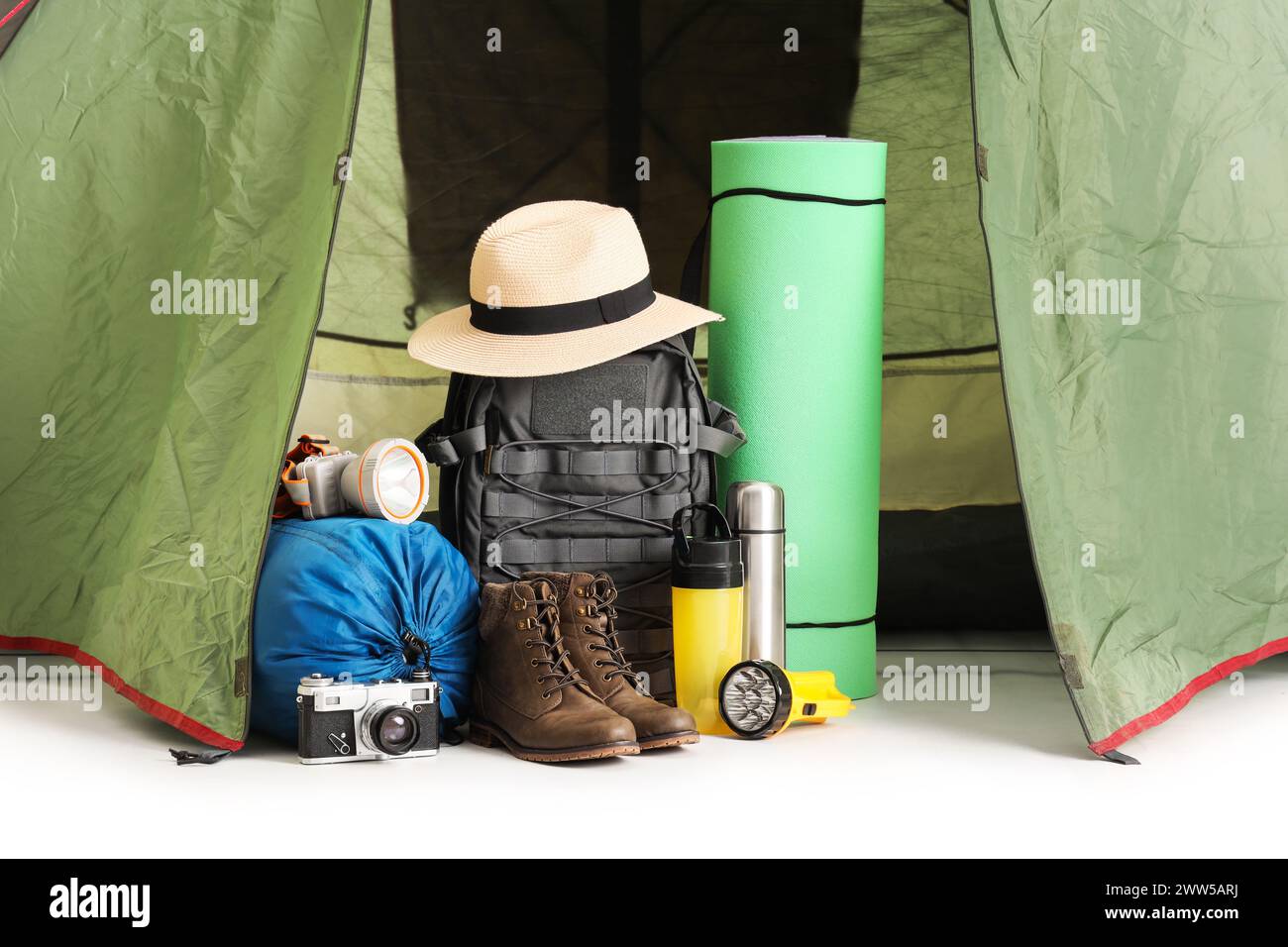 Camping tent with hiking equipment on white background Stock Photo - Alamy