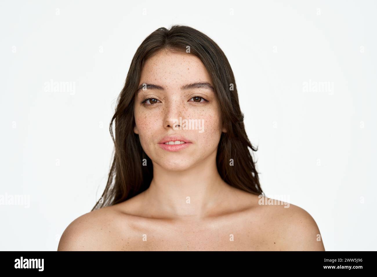 Pretty brunette girl with freckles face, beauty portrait isolated on white. Stock Photo