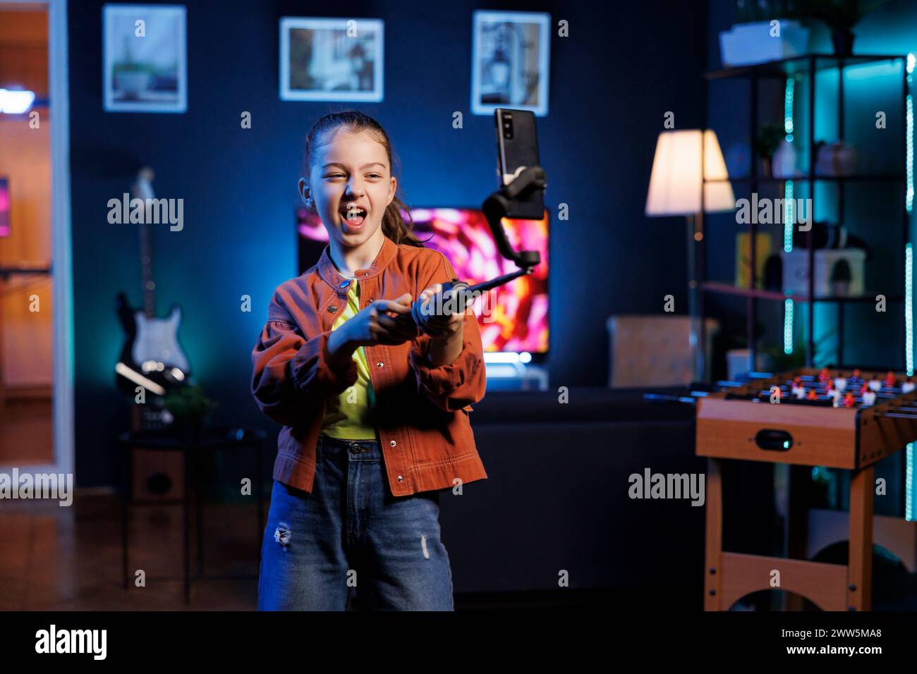 Cheerful gen Z kid joins viral dance craze, recording family friendly