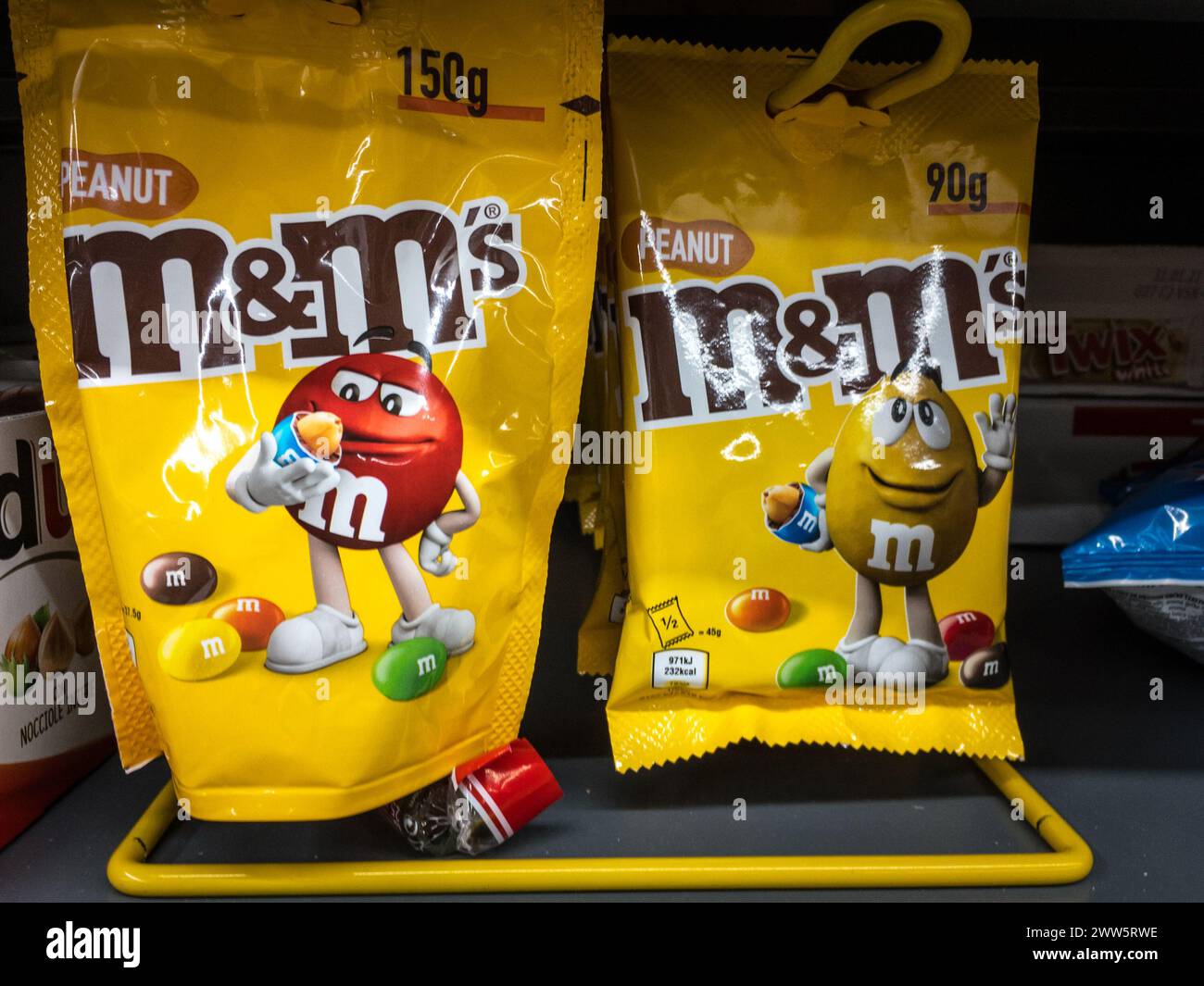 Picture of M&M's bags of dragees for sale in a supermarket in belgrade, serbia. M&M's are color-varied sugar-coated dragée chocolate confectionery, ea Stock Photo