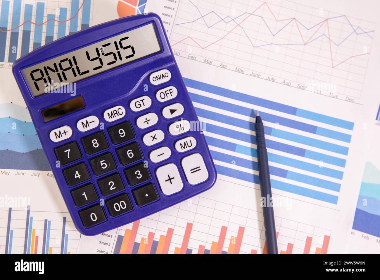 Spreadsheet bank accounts accounting with calculator and magnifying glass. Concept for financial fraud investigation, audit and analysis. Stock Photo