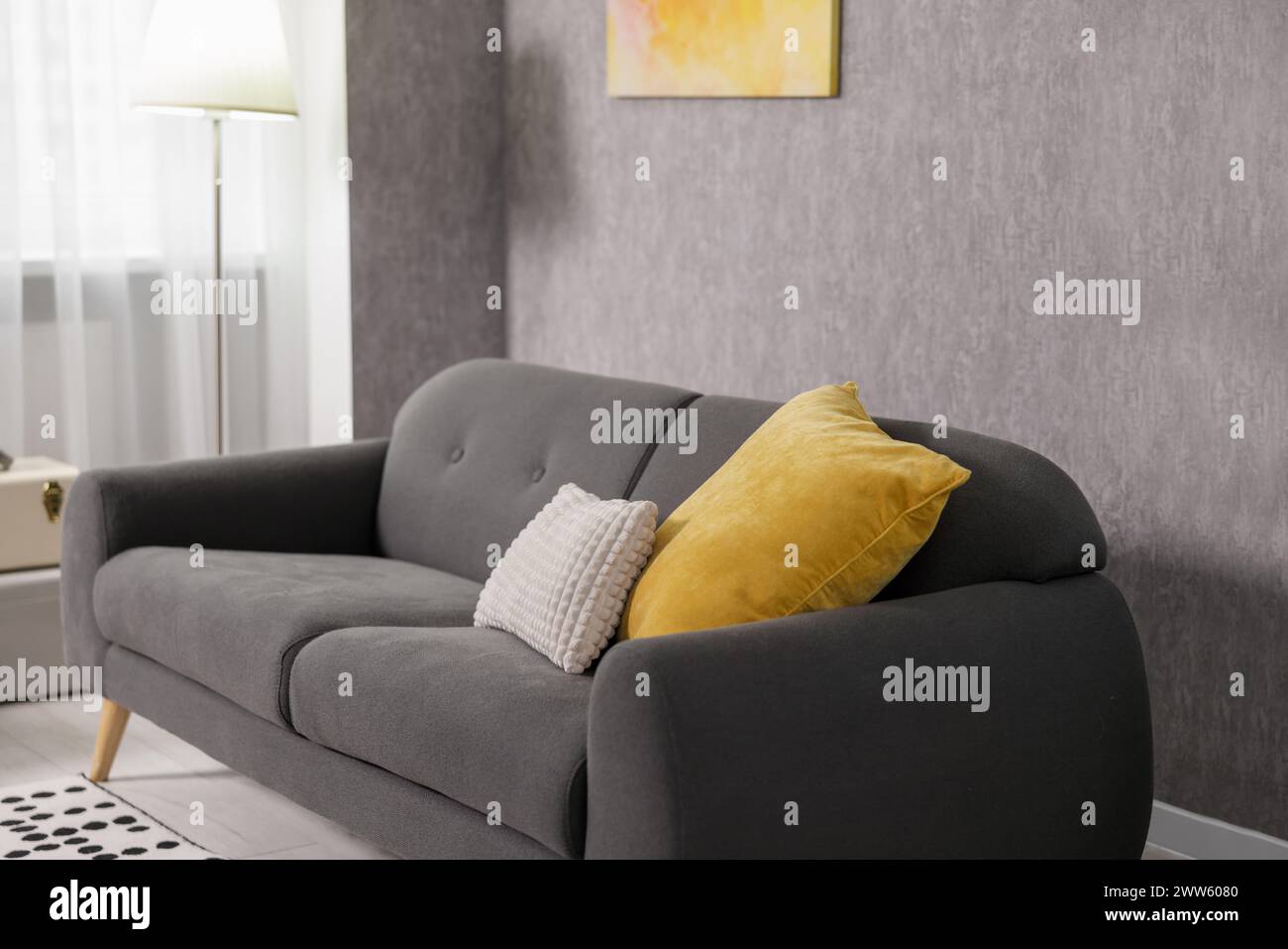 Home renovation. Room interior with stylish gray wallpaper on wall Stock Photo