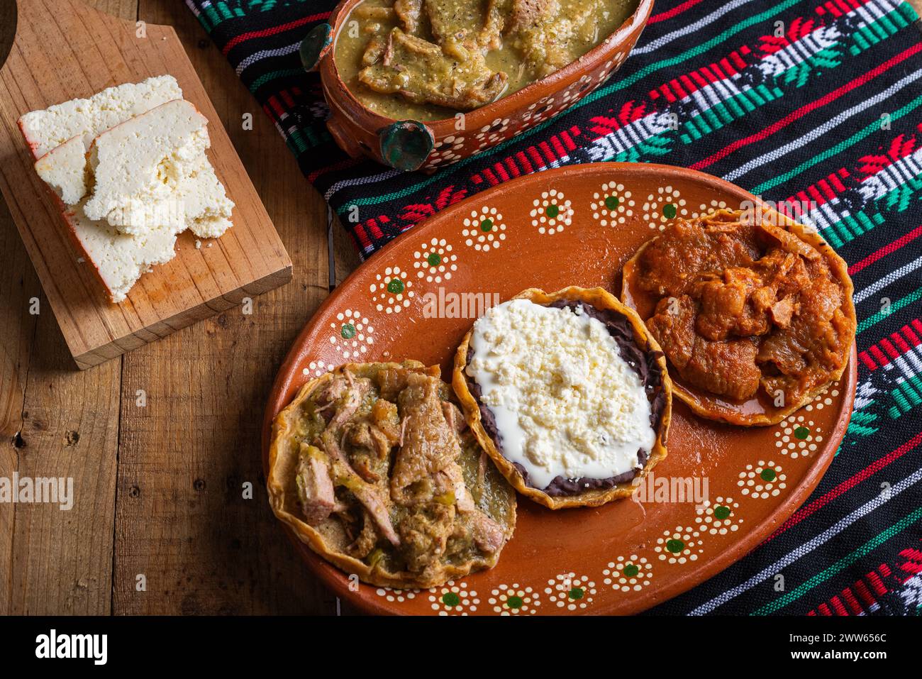 Sopes of chicharron in green sauce and red sauce. Mexican food Stock