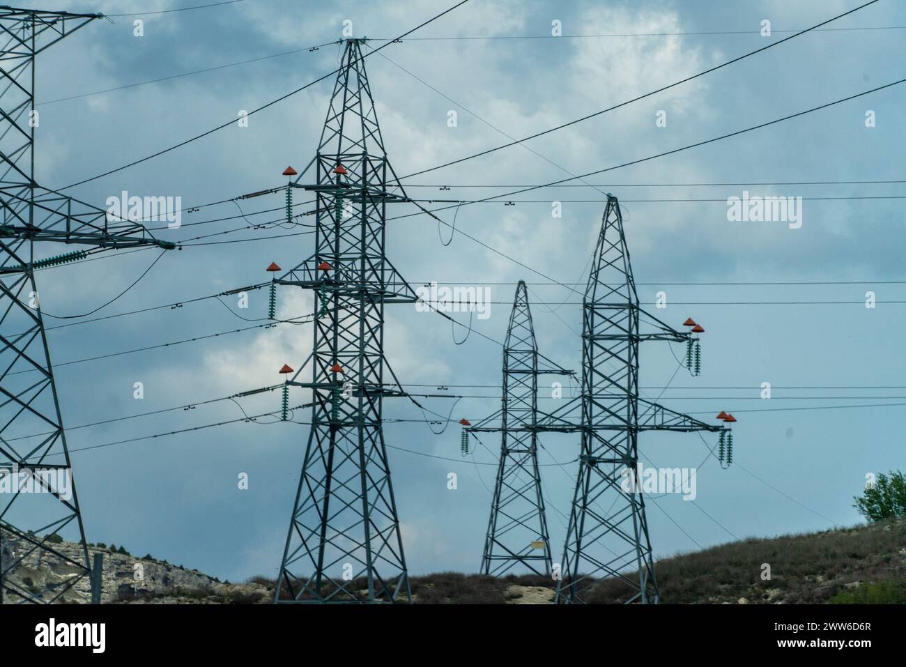 High voltage towers with sky background. Power line support with wires ...