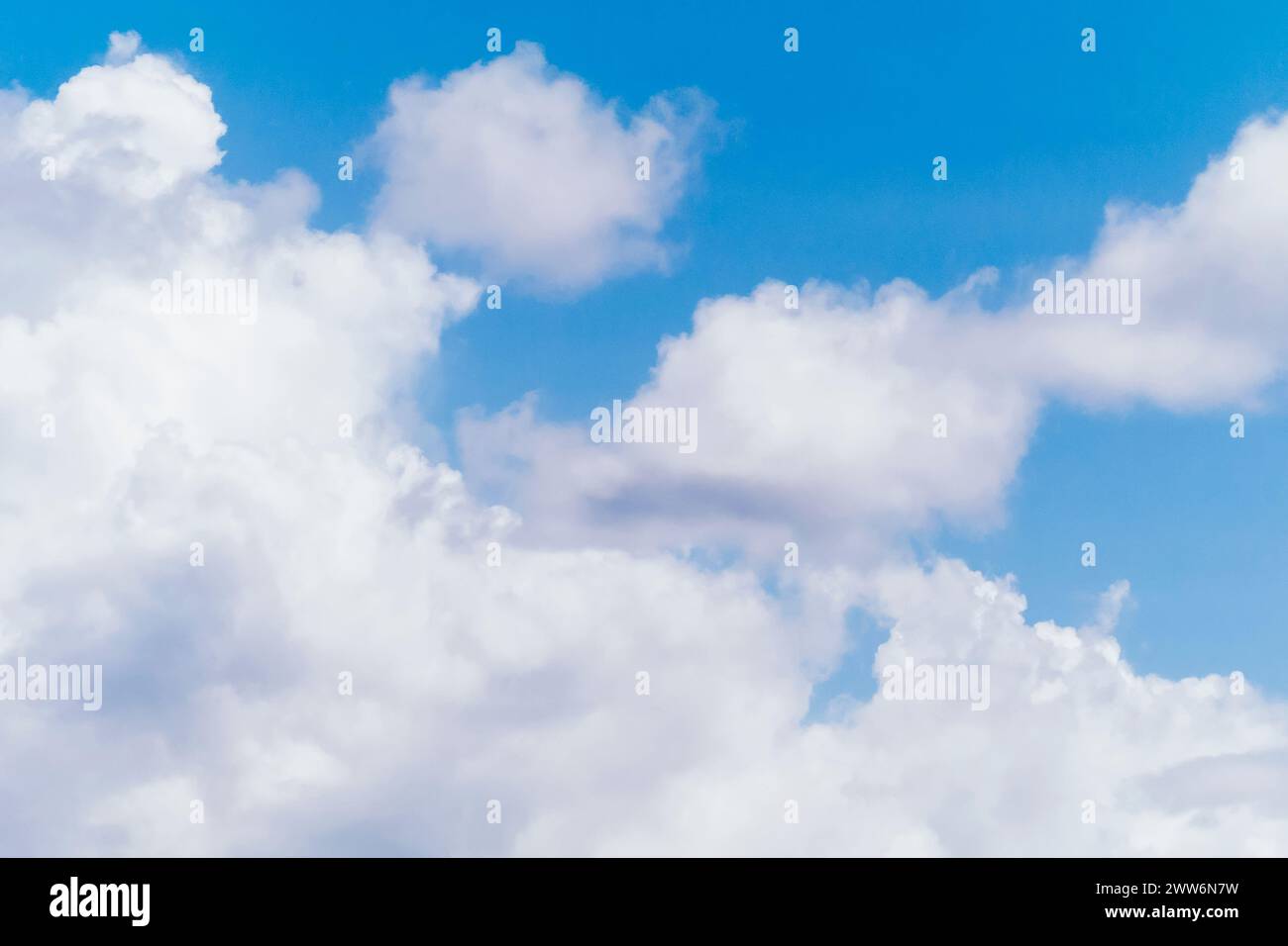 A scenic view of fluffy white clouds over Tumon Beach, Guam, USA Stock Photo