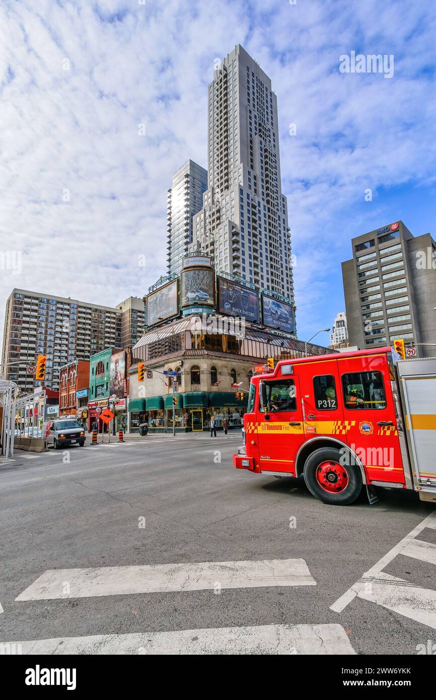 Fire truck of the Toronto Fire Department driving in the downtown ...