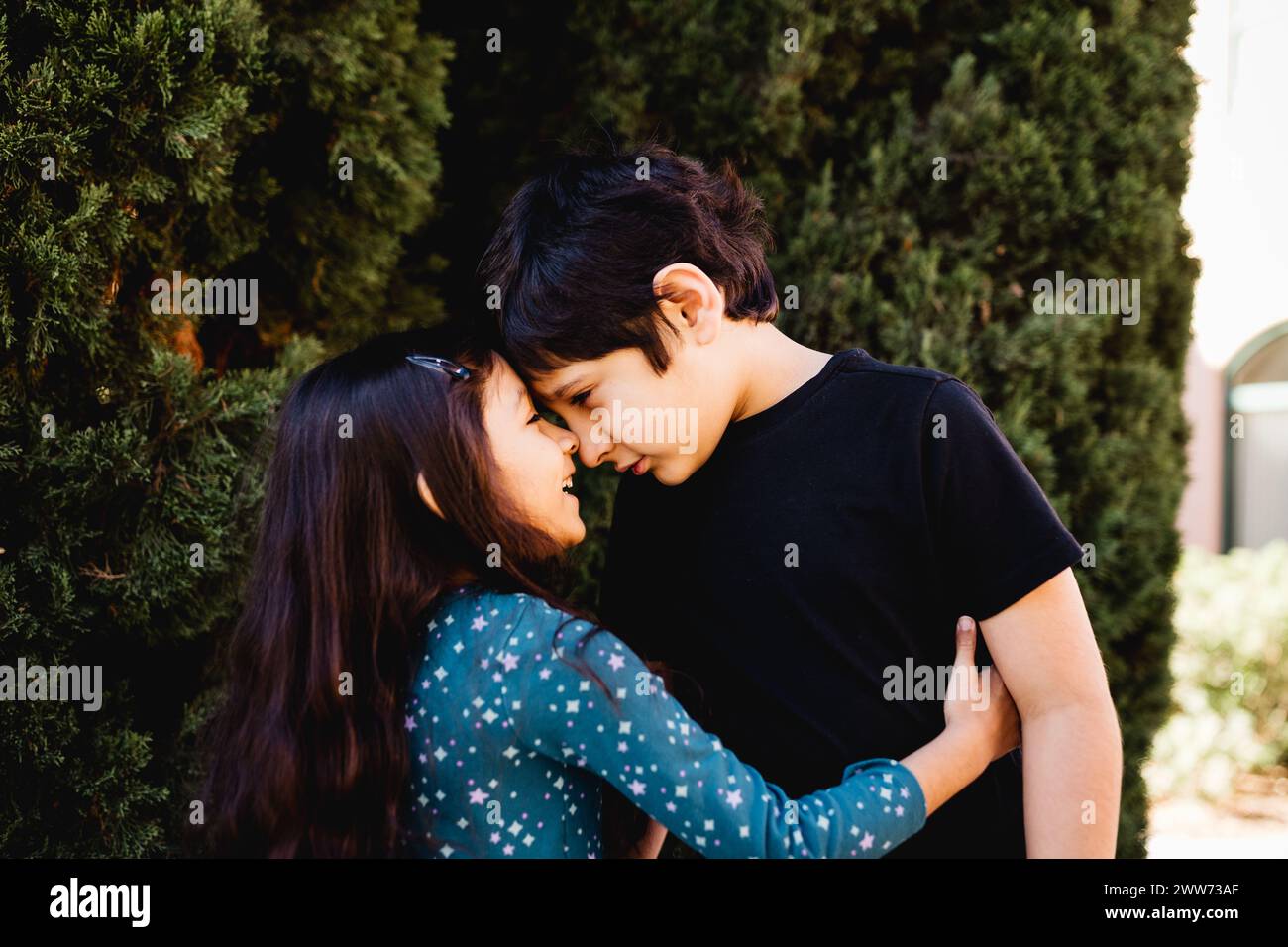 Sister Touches Forehead with Autistic Brother in San Diego Stock Photo ...