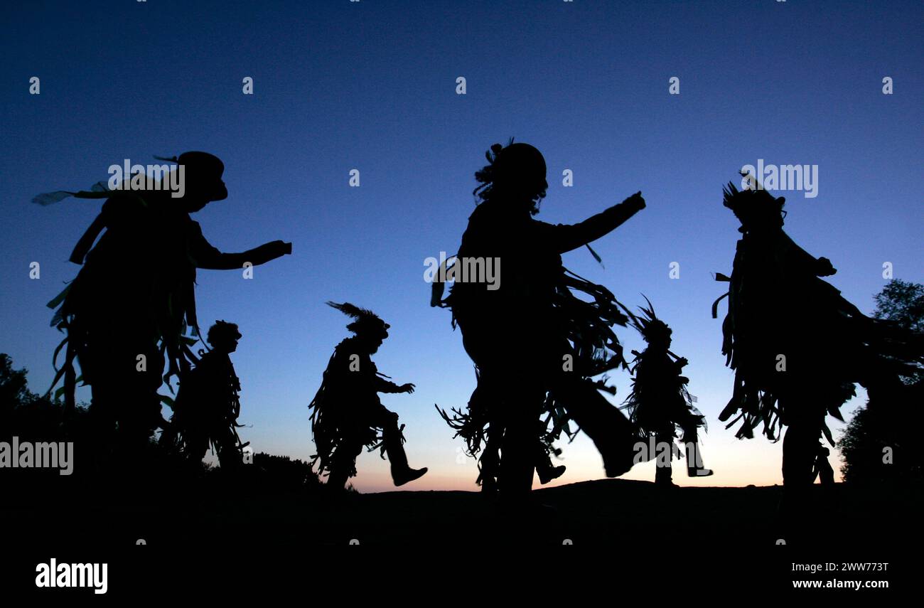 01/05/11. ..As May Day dawn breaks, The Powderkegs - Border Morris Dancers, dance on the top of Alderley Edge,  overlooking the Cheshire Plain. The Po Stock Photo