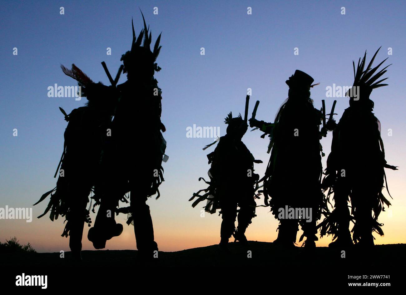 01/05/11. ..As May Day dawn breaks, The Powderkegs - Border Morris Dancers, dance on the top of Alderley Edge,  overlooking the Cheshire Plain. The Po Stock Photo