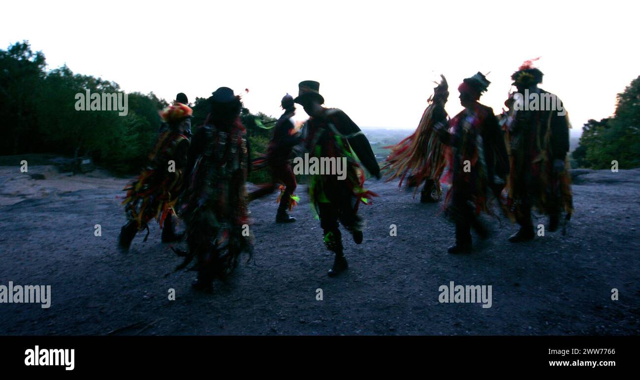 01/05/11. ..As May Day dawn breaks, The Powderkegs - Border Morris Dancers, dance on the top of Alderley Edge,  overlooking the Cheshire Plain. The Po Stock Photo