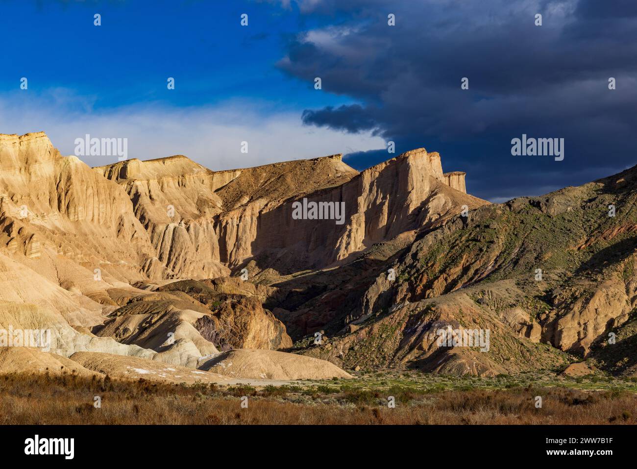 This is a view of  spectacular sandstone cliffs as seen looking south along the China Ranch Trail near Tecopa, Inyo County, California, USA. Stock Photo