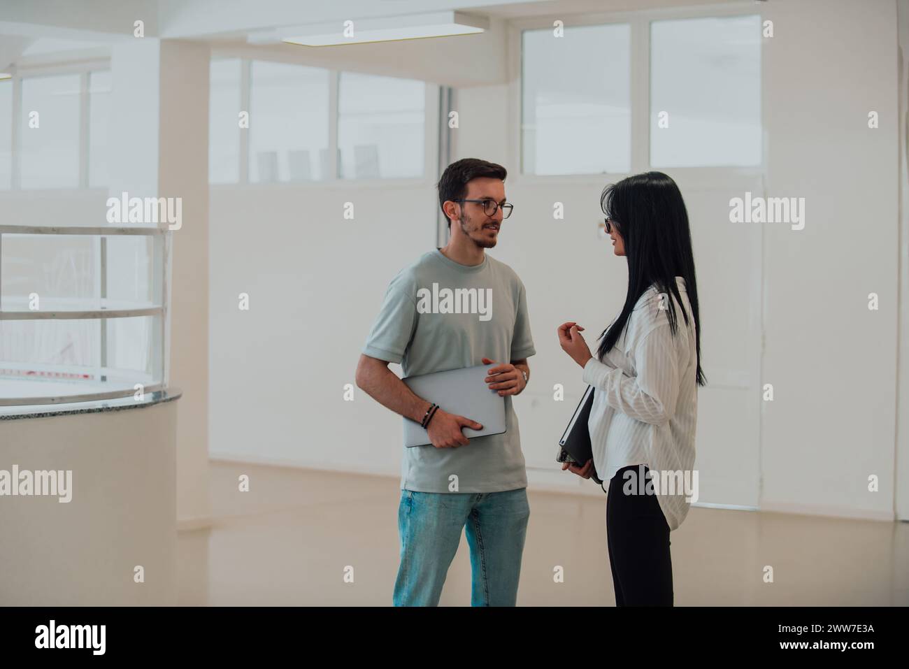 Students Collaborate on a Project in College Library Stock Photo
