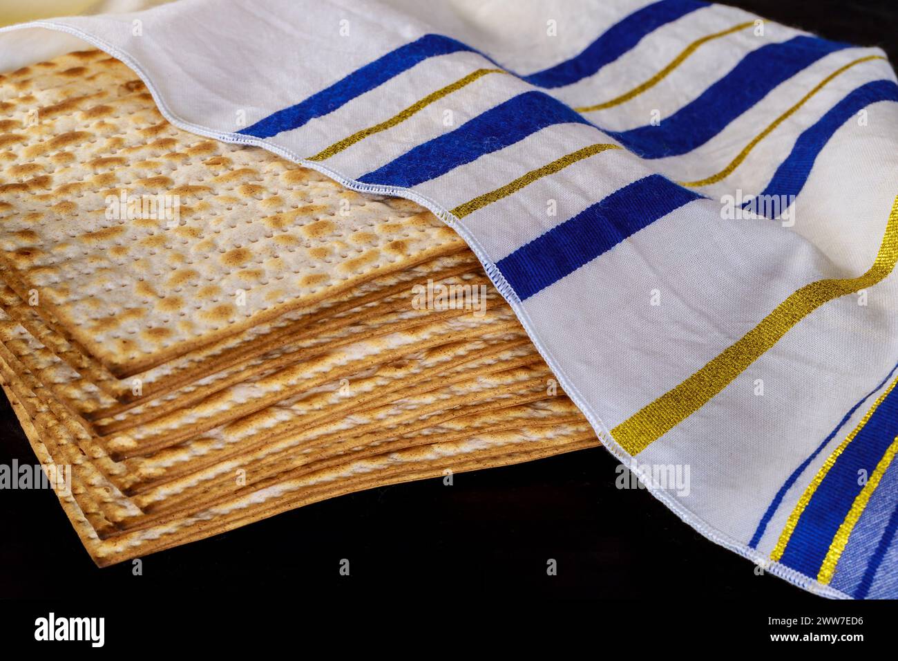 Passover celebration setting table with matzah bread for Jewish holiday Stock Photo