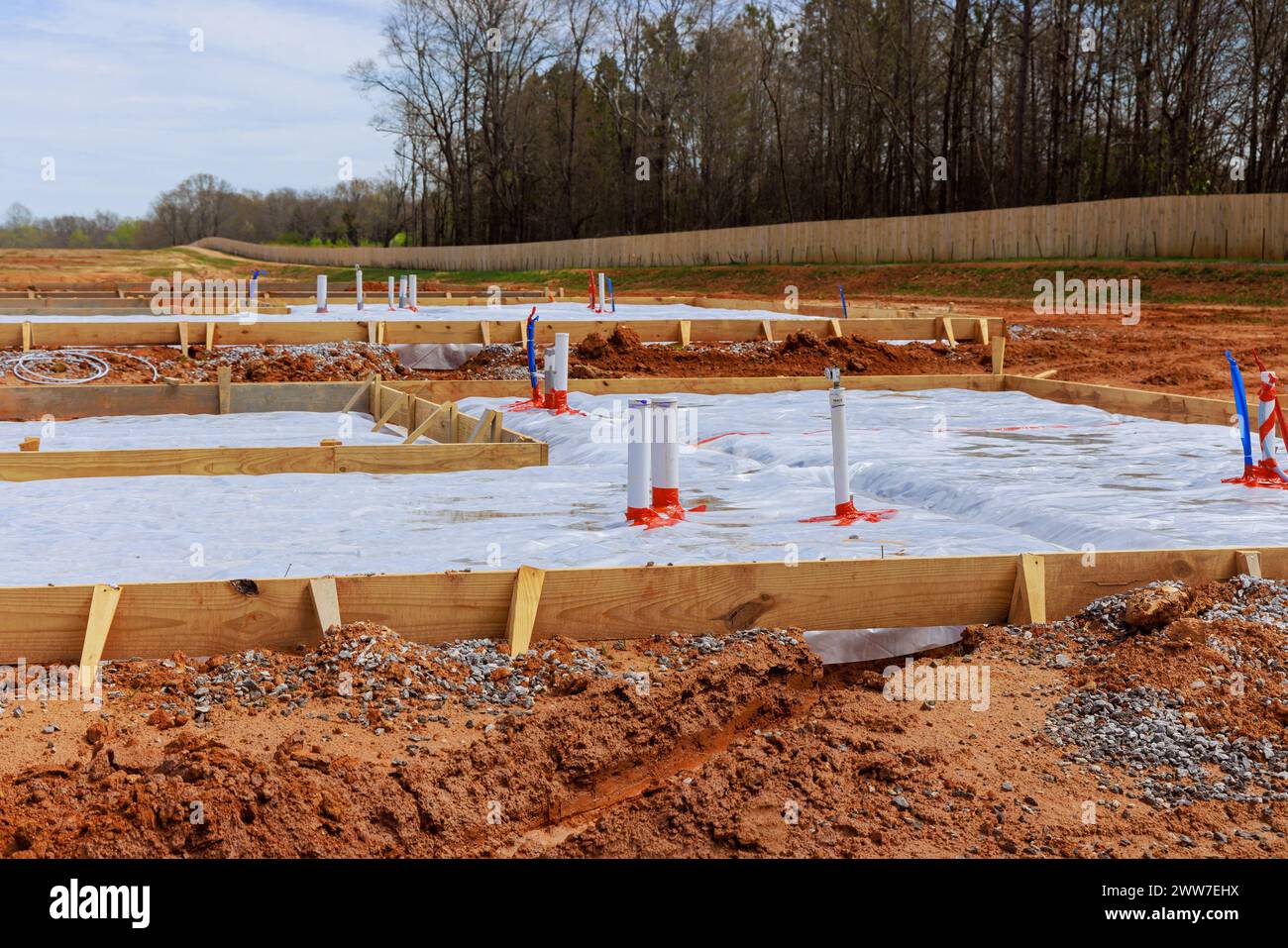 Before pouring foundation of house, ground is covered with installed first insulation waterproofing Stock Photo