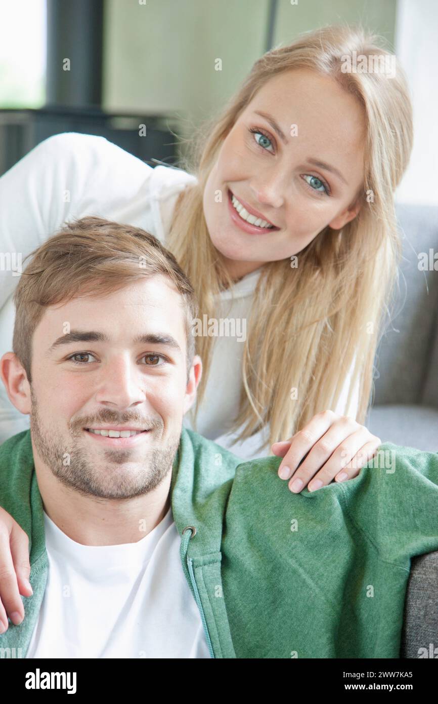 Young women arms around men hi-res stock photography and images - Alamy
