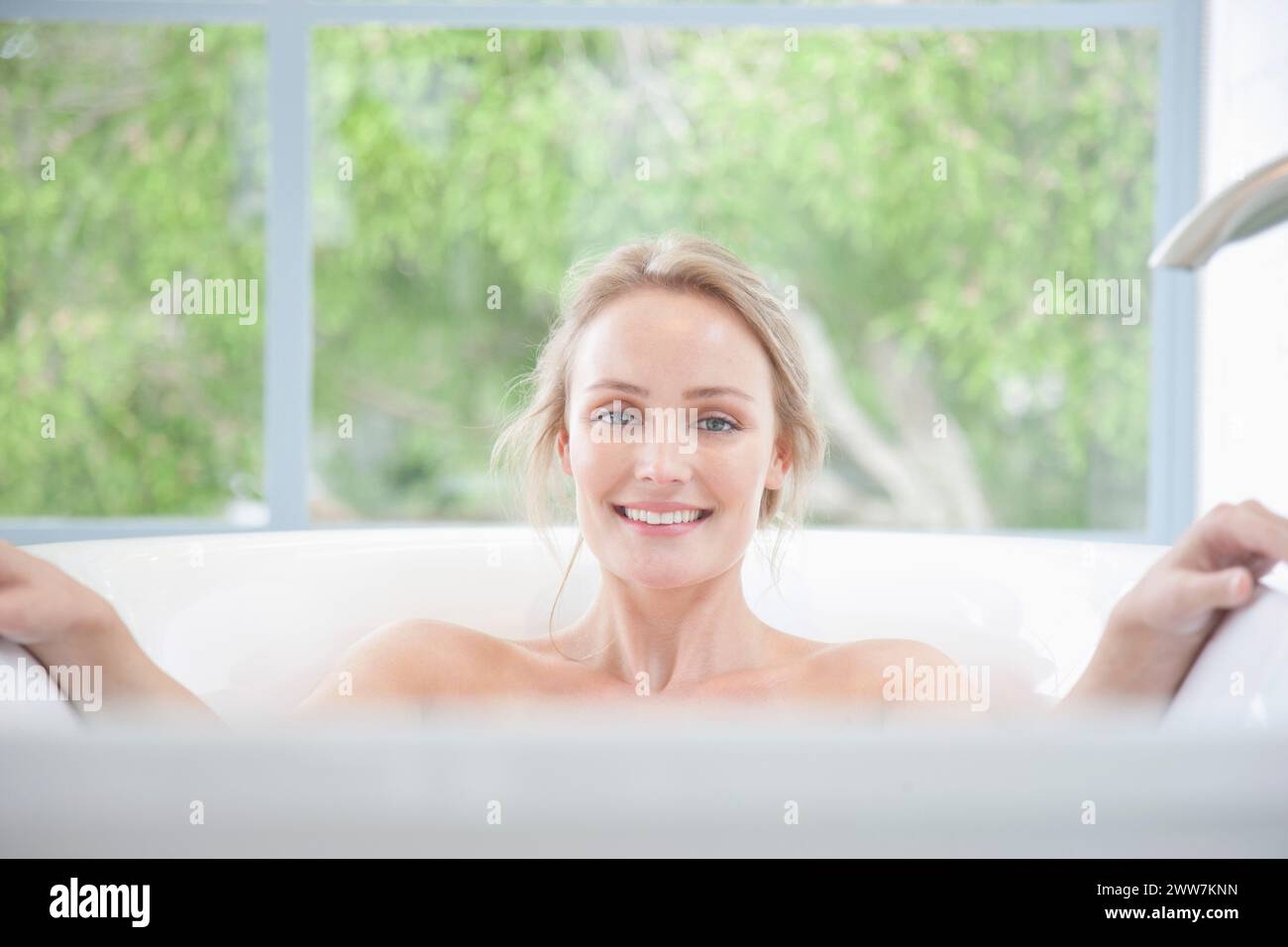 Young blonde woman in bathtub hi-res stock photography and images - Alamy
