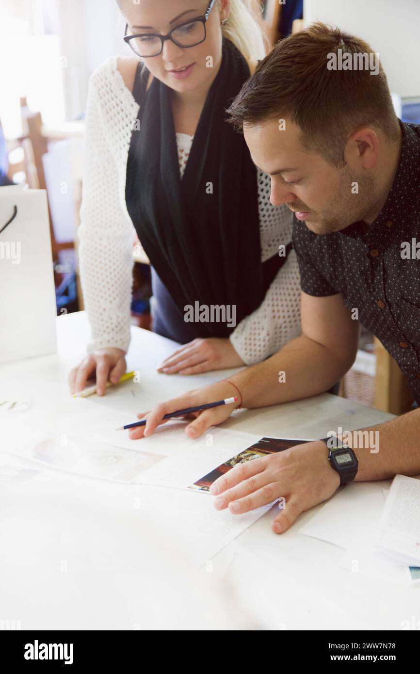 Design Professionals Working at Embroidery Studio Stock Photo