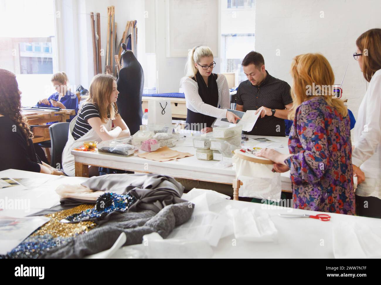 Design Professionals Working at Embroidery Studio Stock Photo