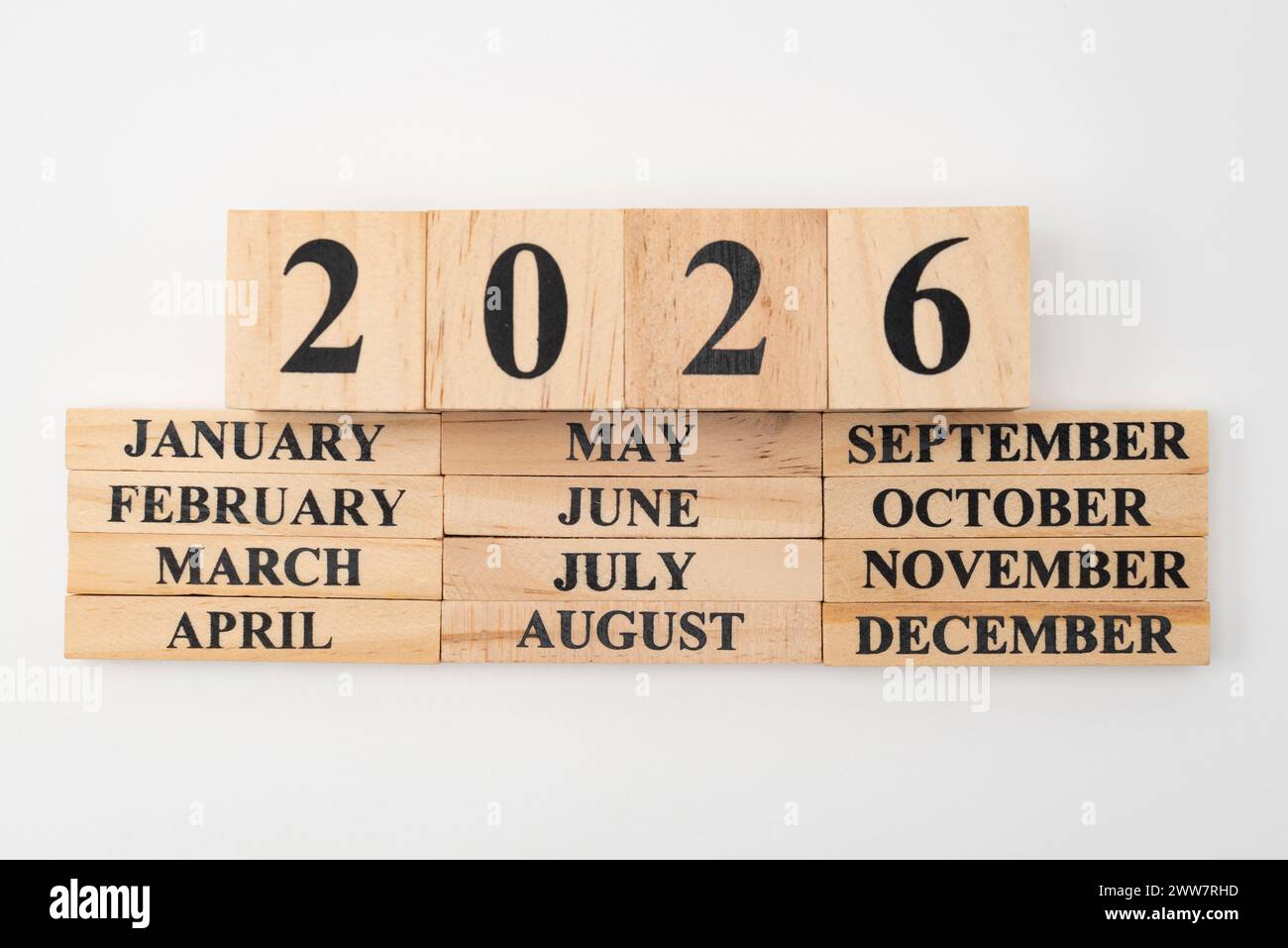 Year 2026 written on wooden cubes on top of the months of the year