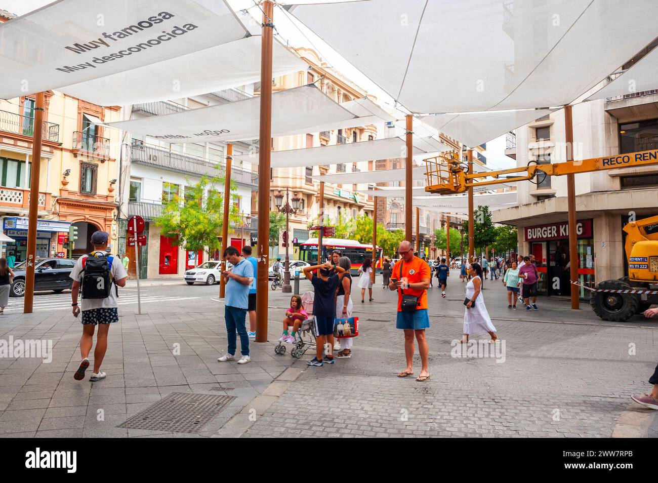 Seville, Spain, Crowd of People, Tourists, Walking, Visiting Street Scene, Historic City Center Stock Photo