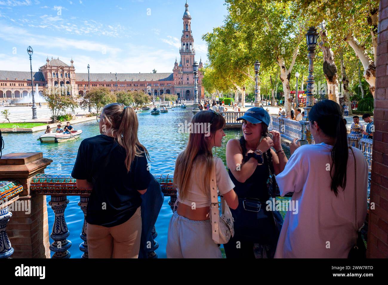Seville, Spain, Groups of People, Young Tourists, From Behind, Visiting Historic Monument, Parque Maria Luisa, Center City, discussion tourism Stock Photo