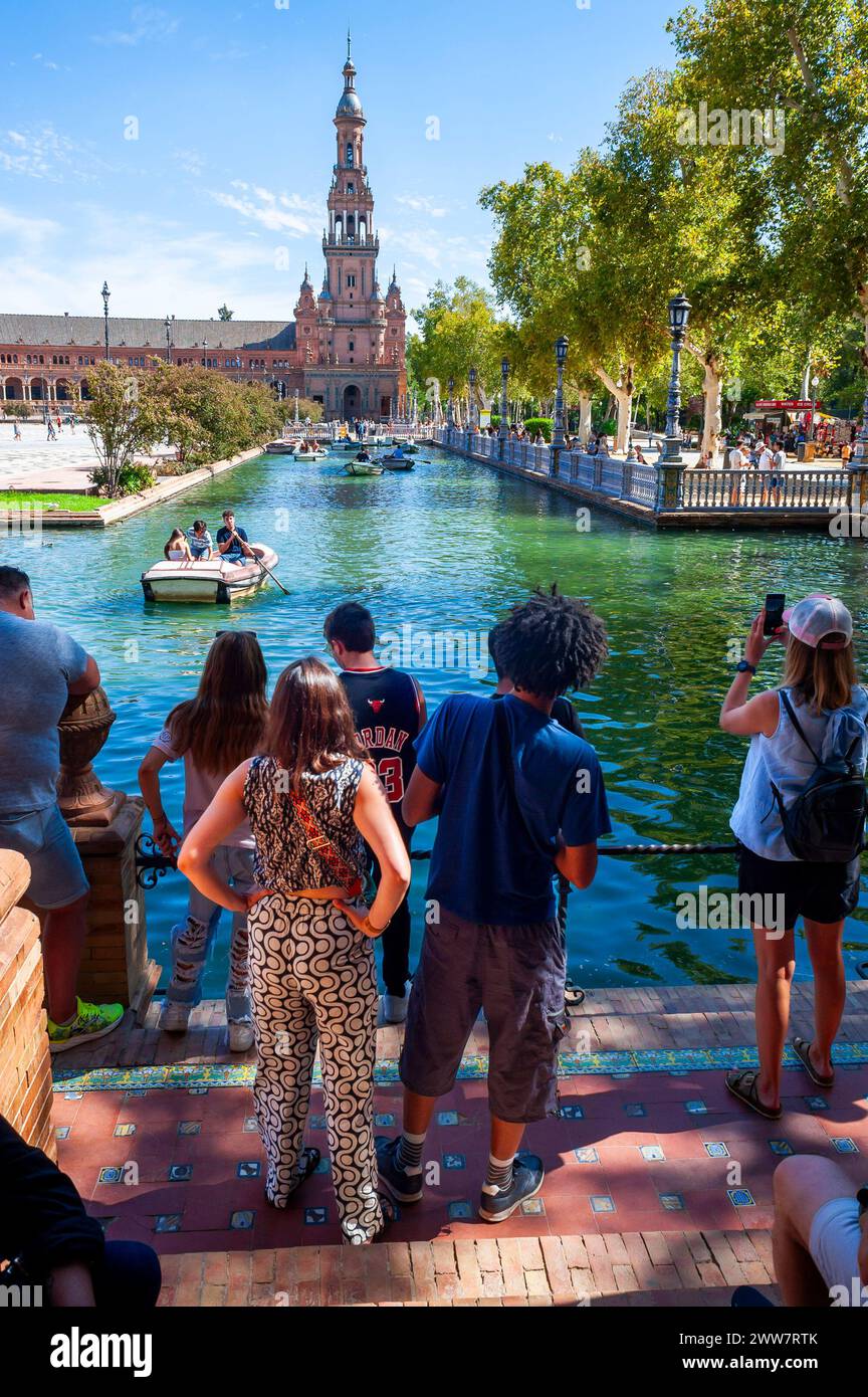 Seville, Spain, Groups of People, Young Tourists, From Behind, Visiting Historic Monument, Parque Maria Luisa, Center City Stock Photo
