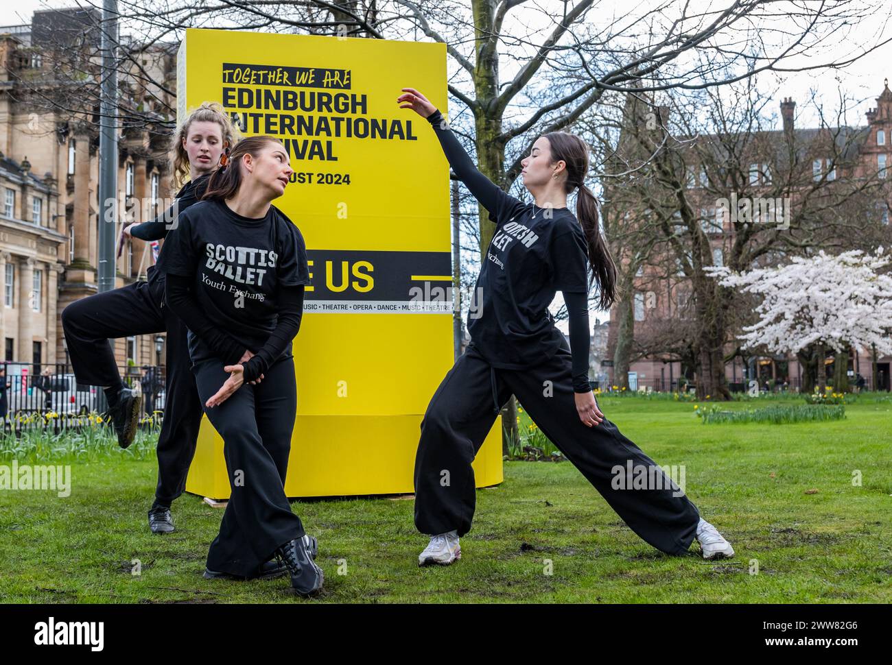 St Andrew Square, Edinburgh, Scotland, UK, 22nd March 2024. Edinburgh International Festival: celebrating tickets now on sale, young dancers in Scottish Ballet's Youth Exchange (who will be appearing in an event at the festival) perform by a mockup of the festival’s programme brochure in a popup event to promote the festival. Credit: Sally Anderson/Alamy Live News Stock Photo
