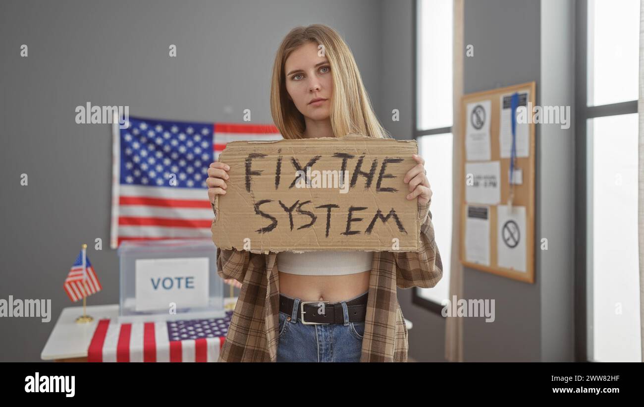 Young woman holding a 'fix the system' sign in a usa electoral college room, portraying activism Stock Photo
