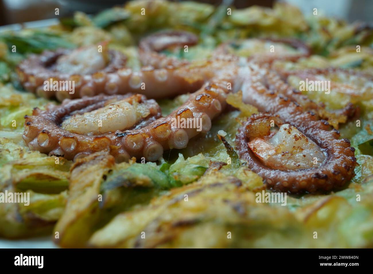 Korean-style pancakes with whole octopus and green onion Stock Photo