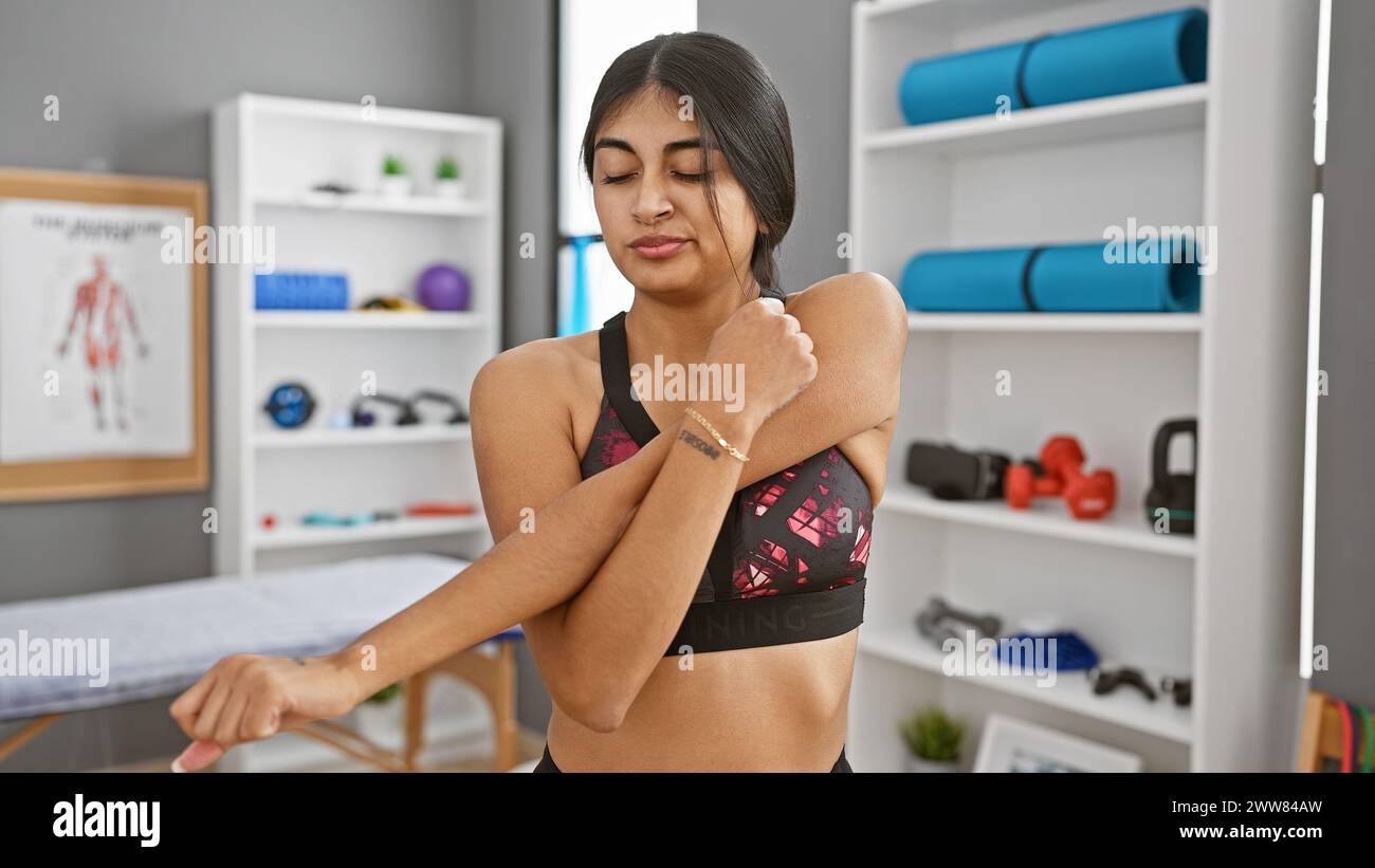 Indian woman stretching arm hi-res stock photography and images - Alamy