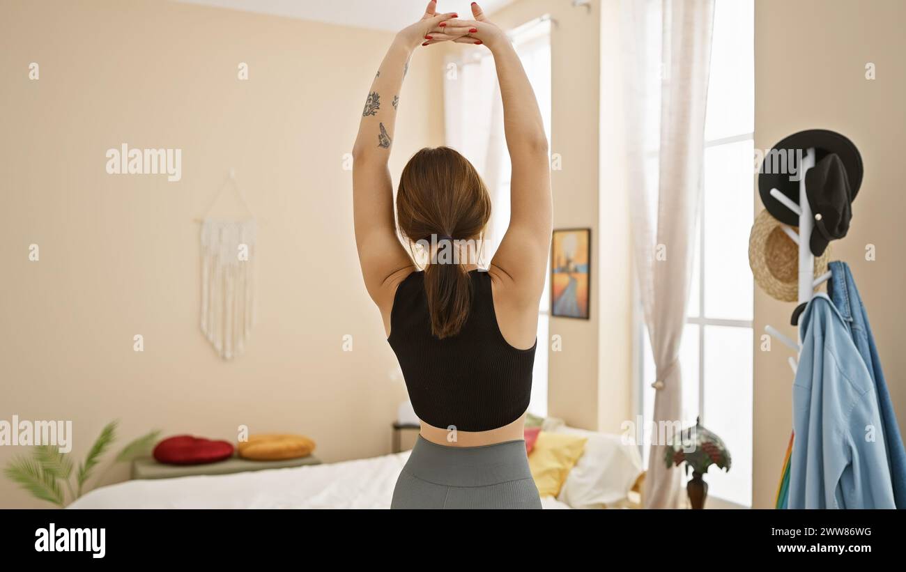 Beautiful woman stretches home showcasing hi-res stock photography and ...