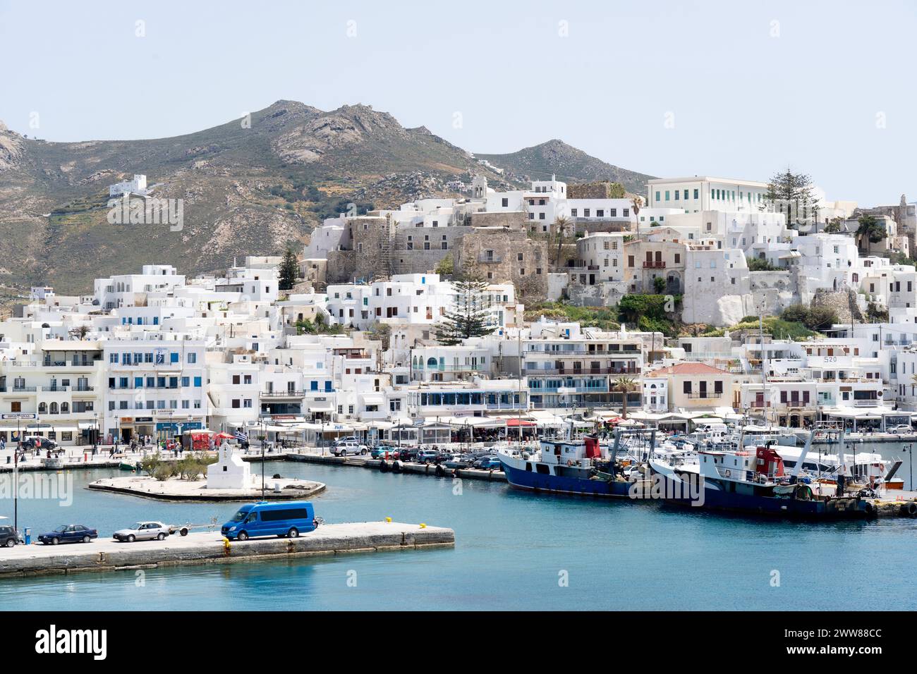 Port of Naxos island, in Cyclades, Greece, Europe. This is Chora, the capital town of Naxos, with the medieval castle atop the settlement. Stock Photo