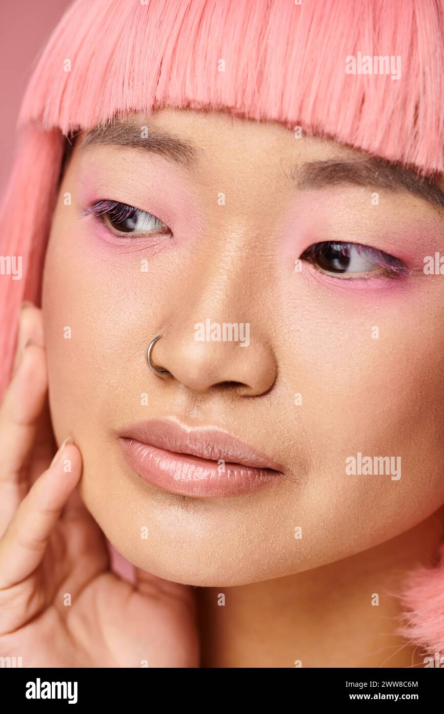 close up of beautiful asian young woman with pink hair and makeup ...