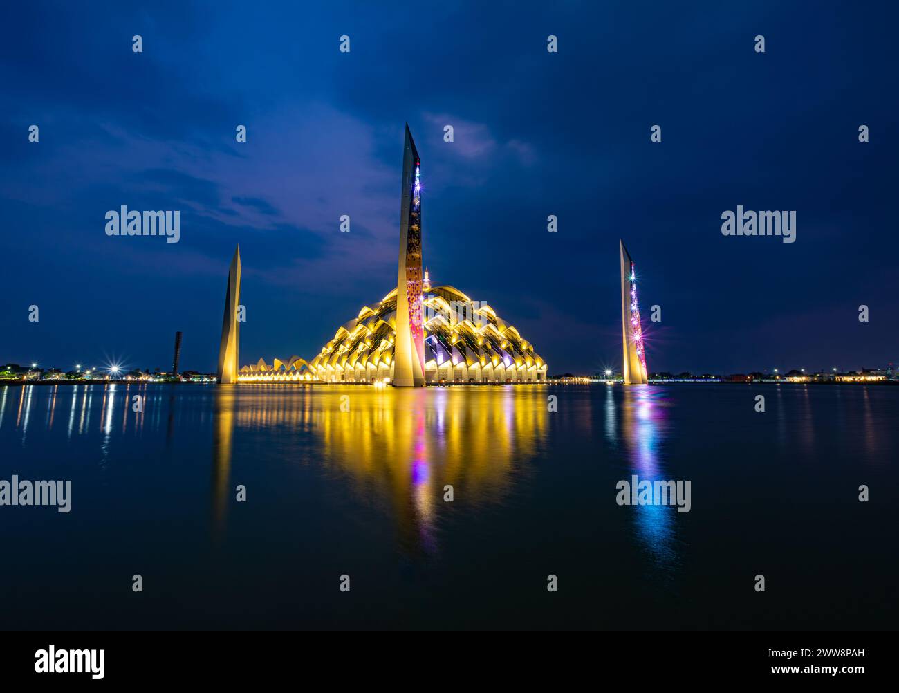 Bandung, Indonesia - 4th Nov 2023: Al Jabbar Great Mosque at night (blue hour) with lamps and reflections in the pond Stock Photo