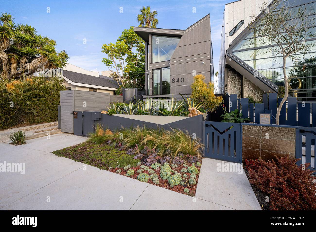 A beautiful modern house exterior with lush green plants in Venice ...