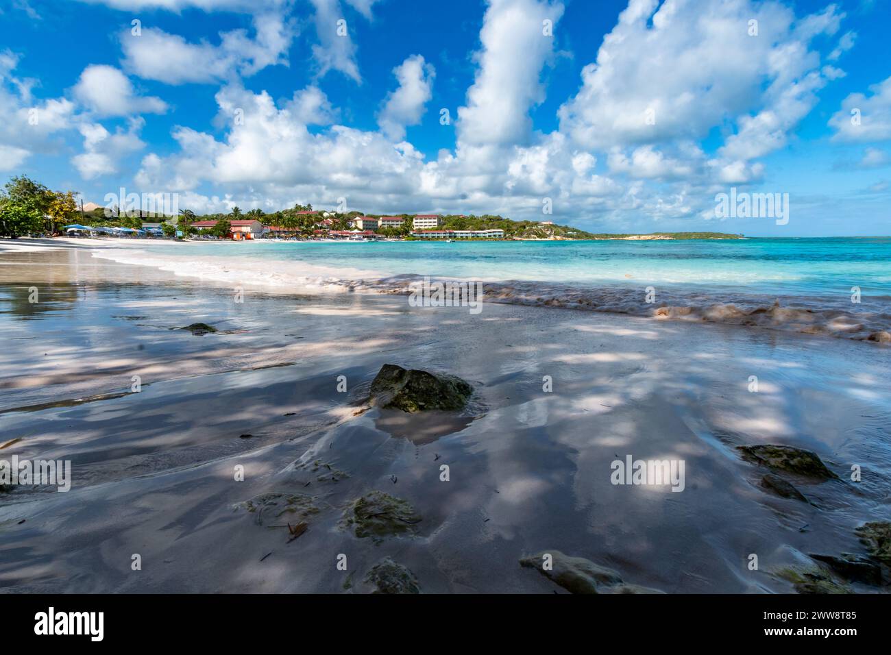 Rocks and Shadows on the sand of a tropical beach in the Caribbean with ...