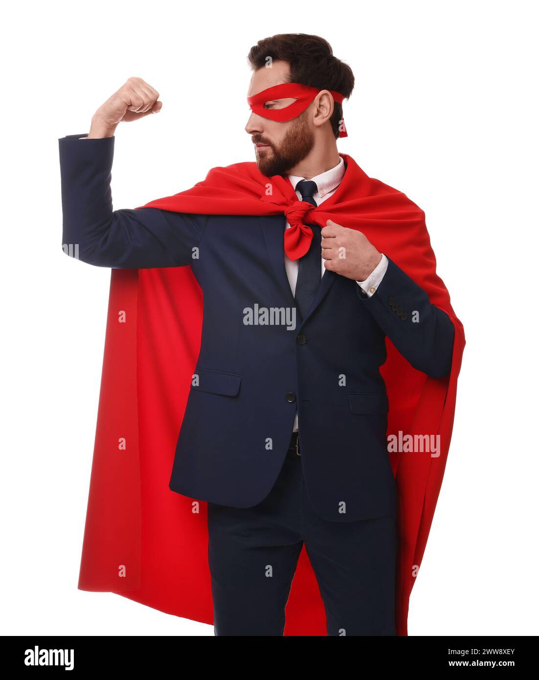 Confident businessman wearing red superhero cape and mask on white ...