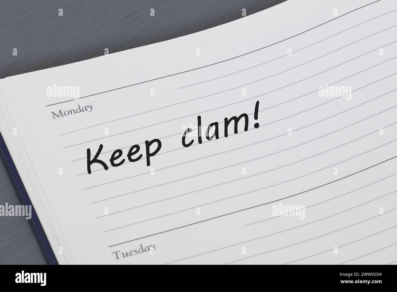 Keep calm reminder message in an open diary Stock Photo