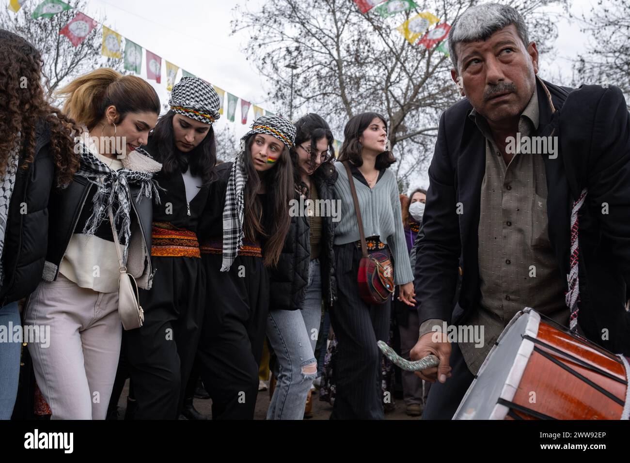 Women dance to the of drums and zurna. Thousands of people gathered in Diyarbakir