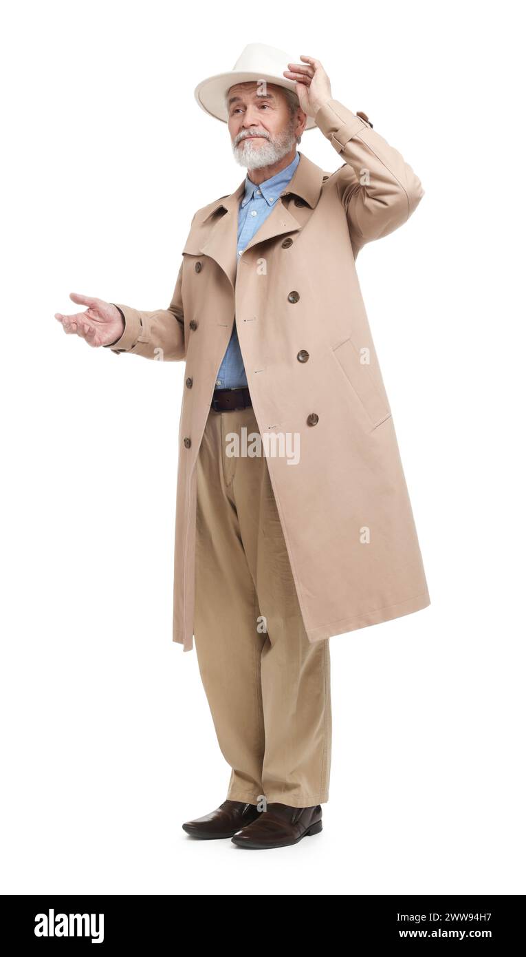 Senior man in hat and coat on white background Stock Photo - Alamy