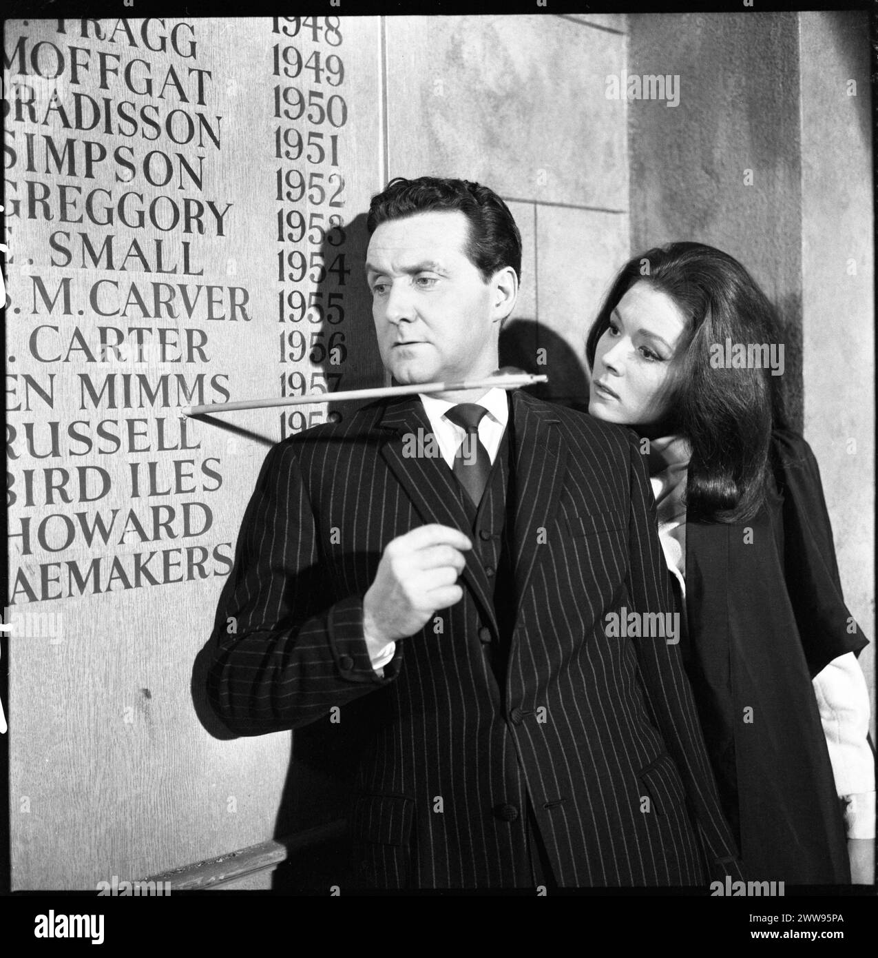 PATRICK MACNEE as John Steed and DIANA RIGG as Emma Peel narrowly miss an arrow  in a scene from the A SENSE OF HISTORY episode 24 of the fourth series of THE AVENGERS TV Series first broadcast on March 8 1966 Director PETER GRAHAM SCOTT Written by MARTIN WOODHOUSE Wardrobe JOHN BATES and JACKIE JACKSON Music LAURIE JOHNSON Associated British Productions for ABC Television Stock Photo