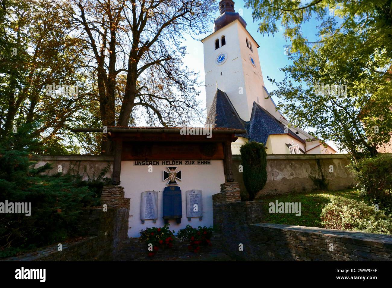 War memorial and St Andreas Church, Piber, Styria, Austria. Stock Photo