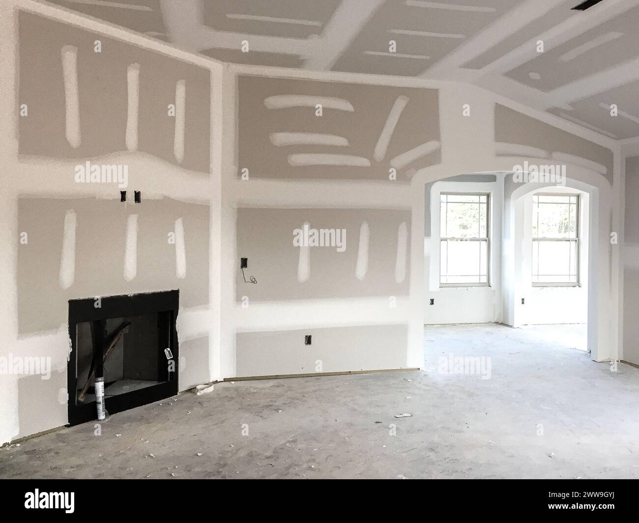 Drywall and taping interior of house construction Stock Photo