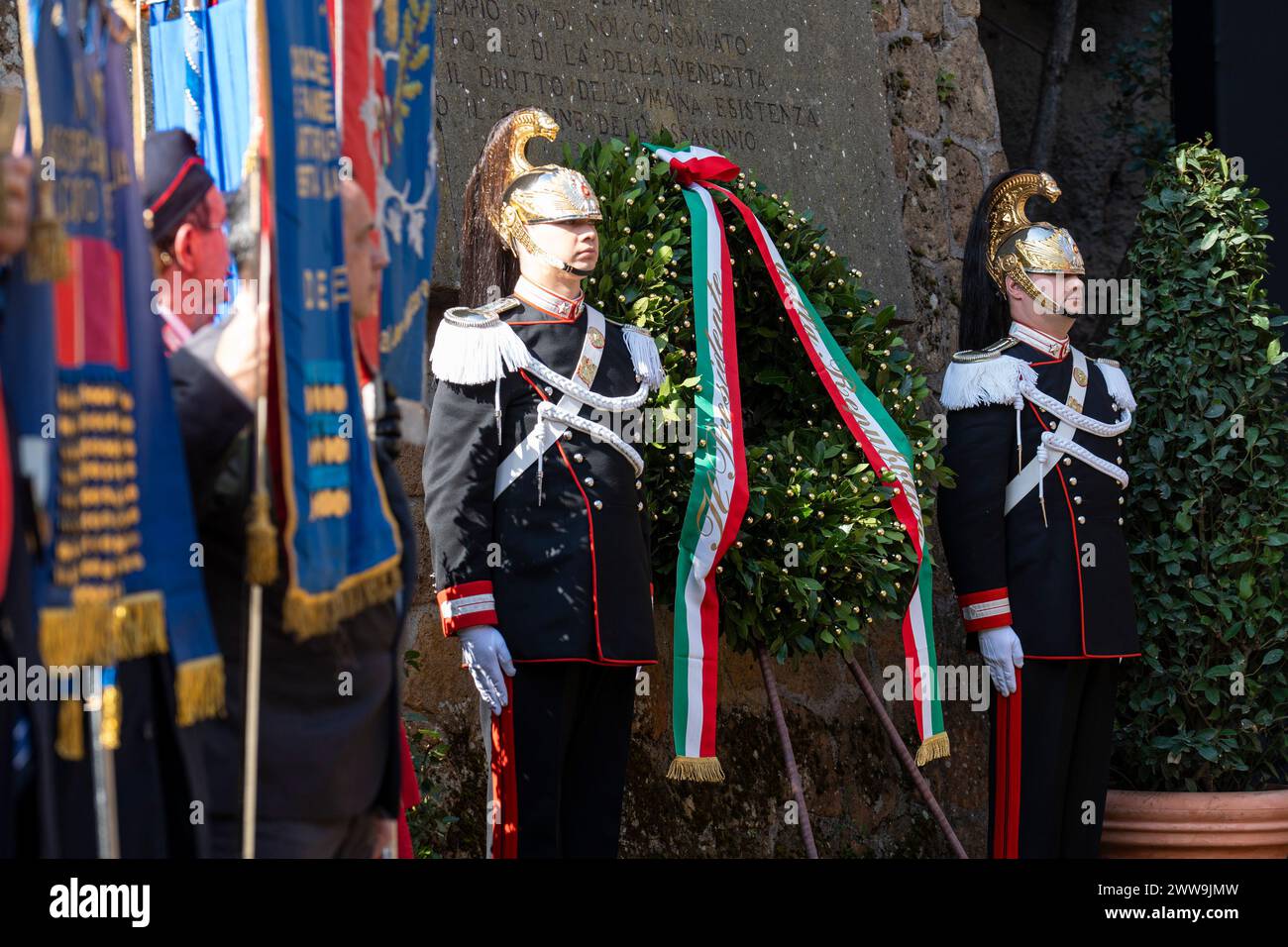 Members of the Corazzieri presidential guards, the Italian Corps of Cuirassiers, pay tribute to the graves of the victims of the Fosse Ardeatine massacre during the ceremony marking the 80th anniversary of the Fosse Ardeatine massacre. The Fosse Ardeatine mass killing of 335 civilians and political prisoners was carried out in this cave area in Rome on 24 March 1944 by German occupation troops during the Second World War as a reprisal for a partisan attack conducted on the previous day in central Rome against the SS Police Regiment Bozen. Credit: SOPA Images Limited/Alamy Live News Stock Photo