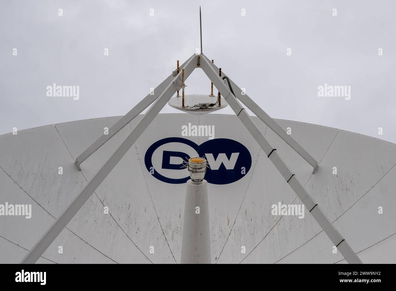 Berlin, Germany. 22nd Mar, 2024. A satellite dish with the inscription DW stands on the roof of the capital city headquarters of the broadcaster Deutsche Welle. DW is a public-law institution and works across three media: television, radio and the internet. Credit: Monika Skolimowska/dpa/Alamy Live News Stock Photo
