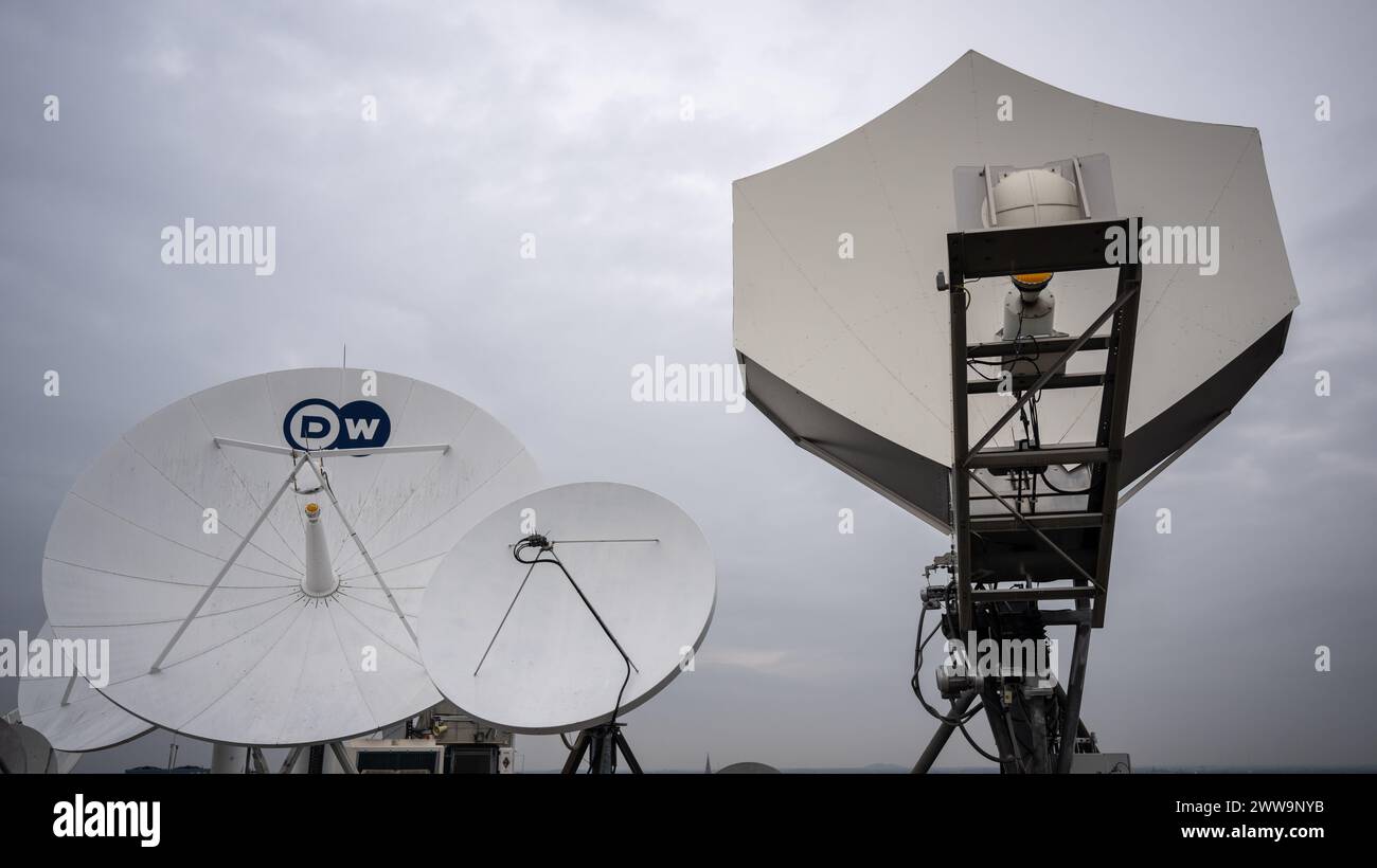 Berlin, Germany. 22nd Mar, 2024. Satellite dishes stand on the roof of the capital city headquarters of the broadcaster Deutsche Welle. DW is a public-law institution and works across three media: television, radio and the internet. Credit: Monika Skolimowska/dpa/Alamy Live News Stock Photo