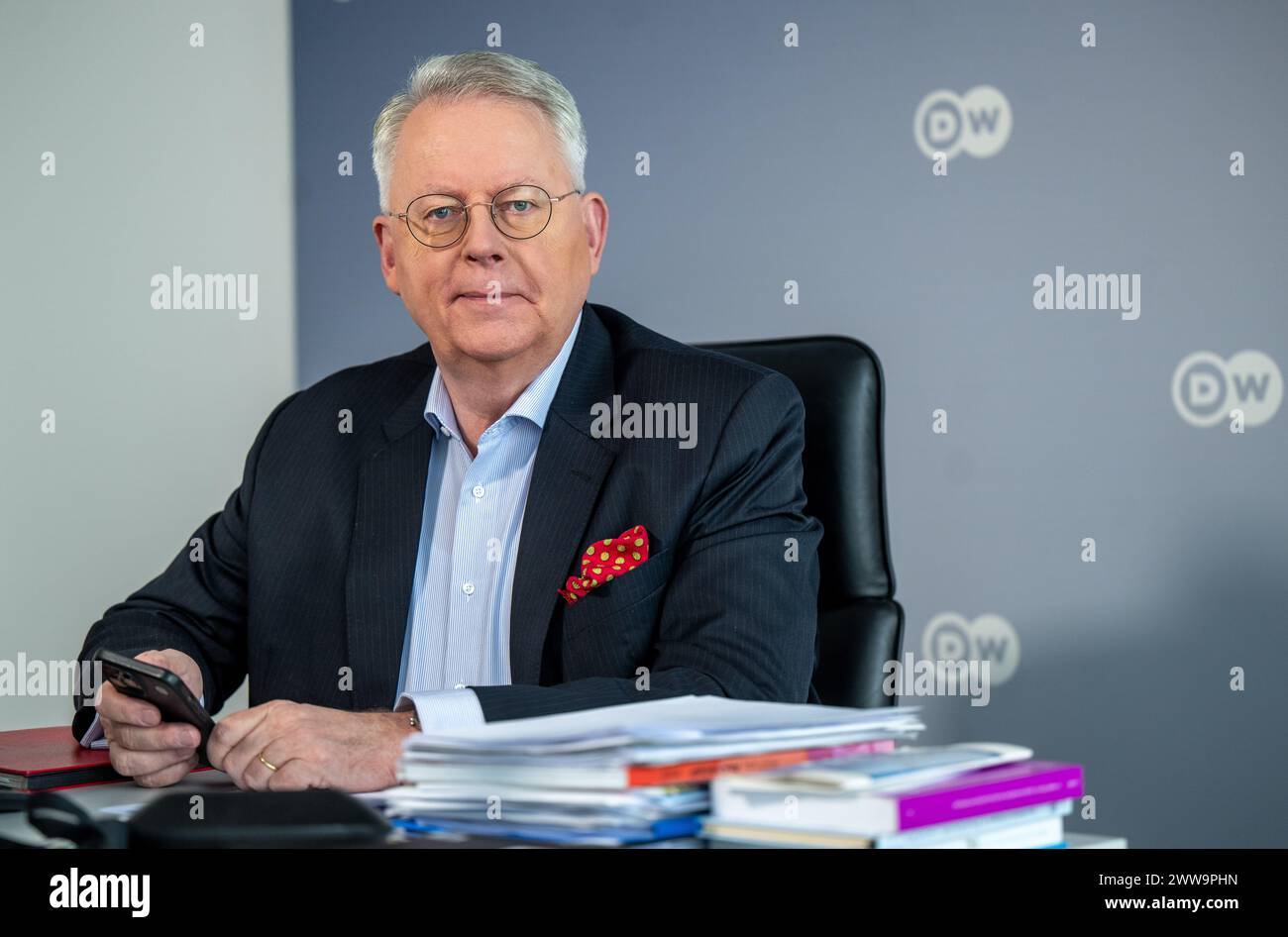 Berlin, Germany. 22nd Mar, 2024. Peter Limbourg, Director-General of Deutsche Welle, sits in his office at the broadcaster's headquarters in the capital. DW is a public-law institution and works across three media: television, radio and the internet. Credit: Monika Skolimowska/dpa/Alamy Live News Stock Photo