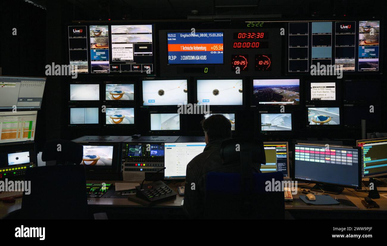 Berlin, Germany. 22nd Mar, 2024. An employee sits in the control room at the capital city headquarters of the broadcaster Deutsche Welle. DW is a public-law institution and works across three media: television, radio and the Internet. Credit: Monika Skolimowska/dpa/Alamy Live News Stock Photo