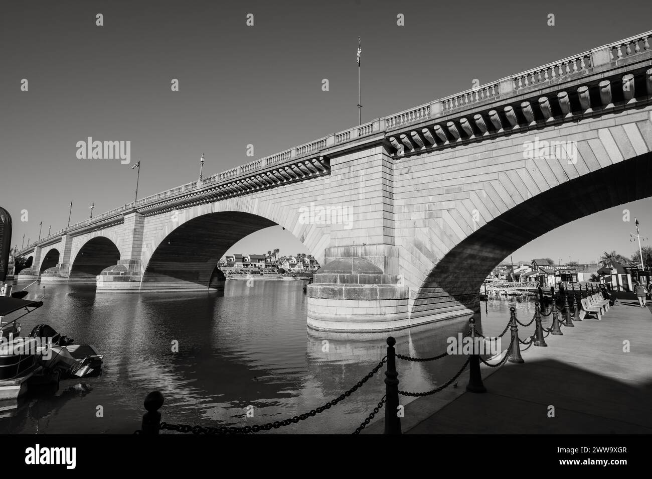 Tourists near the old London Bridge, which was relocated from London England in the 1970’s to Lake Havasu Arizona.  Black and white image. Stock Photo