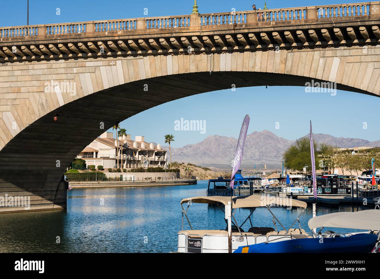 Tourists near the old London Bridge, which was relocated from London England in the 1970’s to Lake Havasu Arizona. Stock Photo